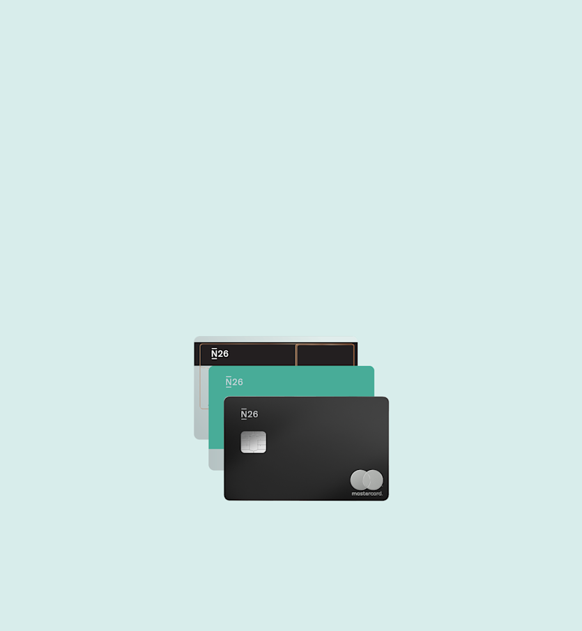 Three N26 bank cards in different colors are stacked on top of each other.