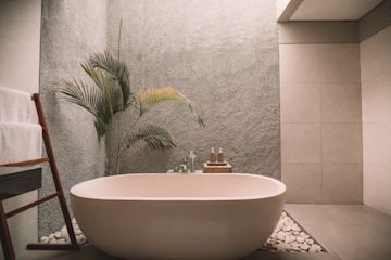 A bathtub in a hotel room.