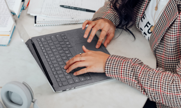 Woman using a laptop.