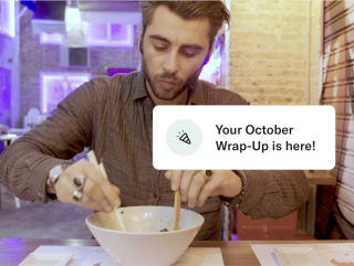 Your October wrap-up notification is here with a background image of a person eating in a restaurant.