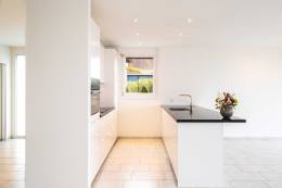 A bright white kitchen.