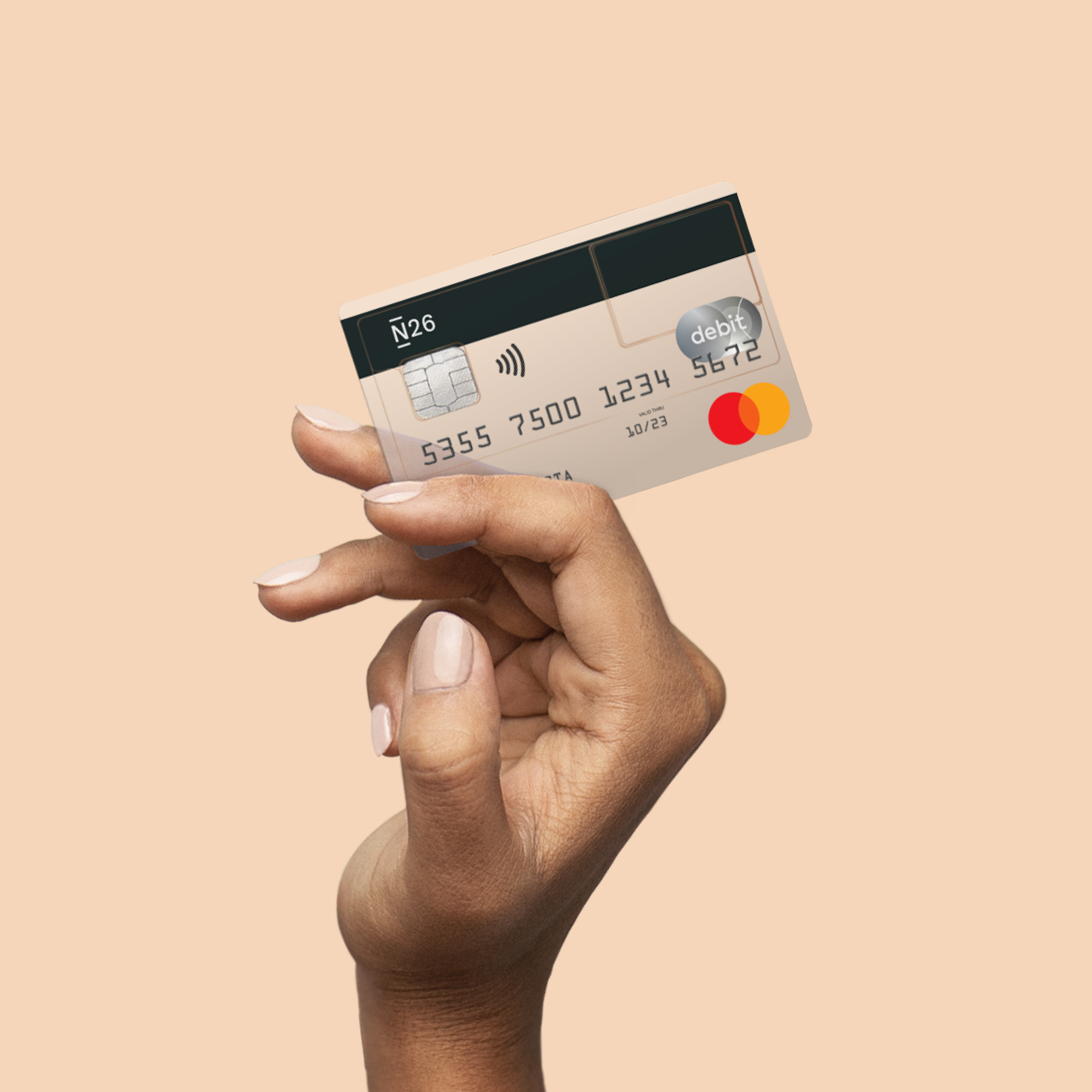 An elevated hand holding a transparent N26 Standard card.