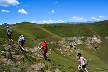 Tourist using their vacation to do hiking and climbing a mountain.