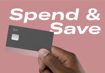 hand holding a N26 debit card with the words "Spend" and "Save" in the background.