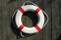 A red and white life buoy.