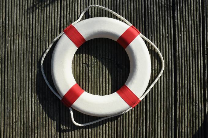 A red and white life buoy.
