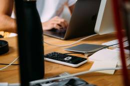 A freelance accountant working on a desk.