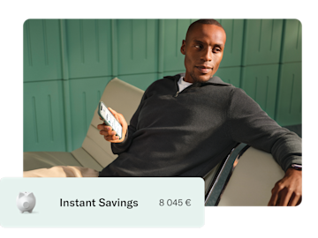  A man sits on a bench holding a smartphone, with an overlay showing 'Instant Savings' and a balance of 8,045 €.
