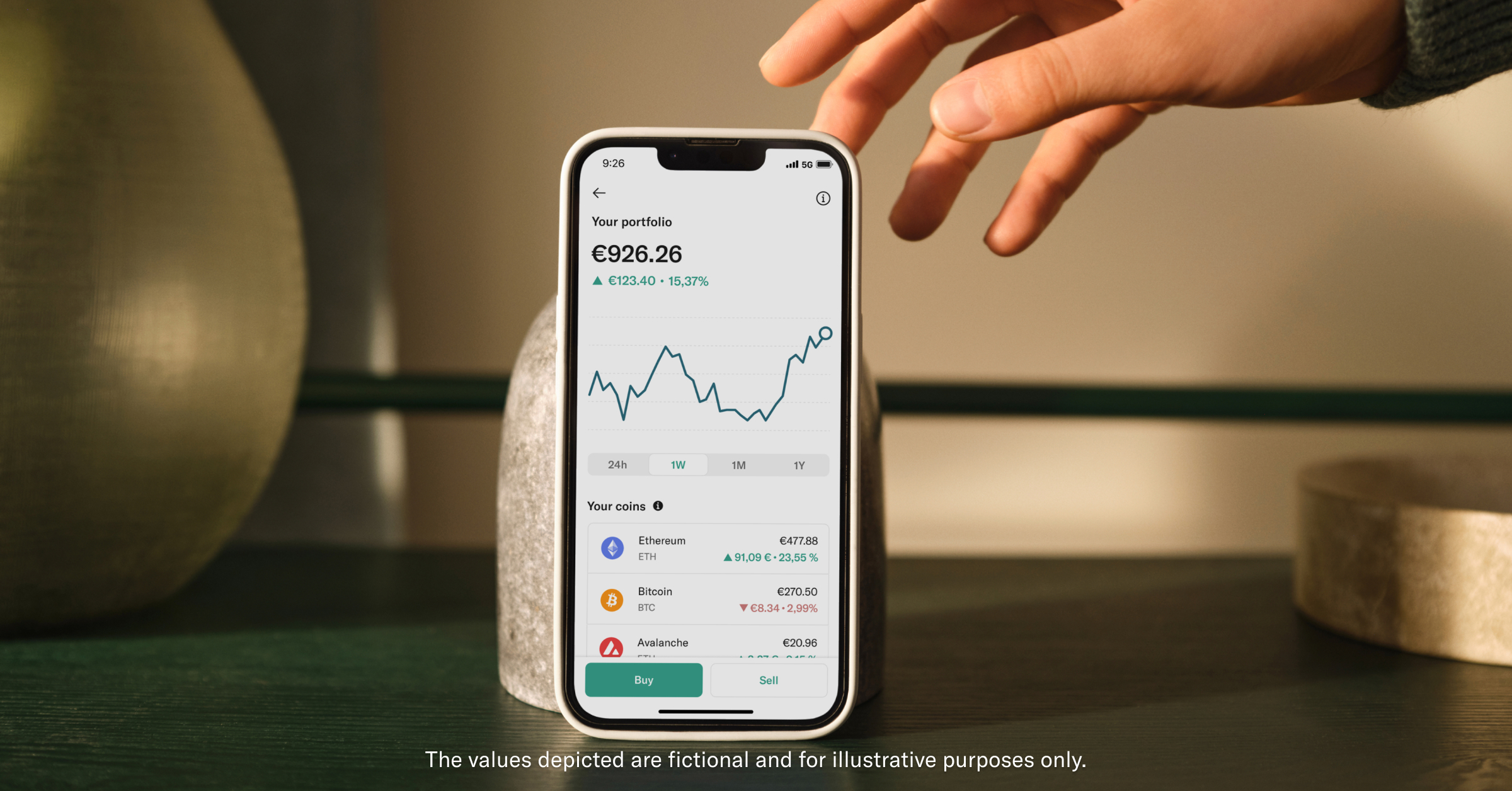 Hand reaching for phone featuring N26 Crypto.
