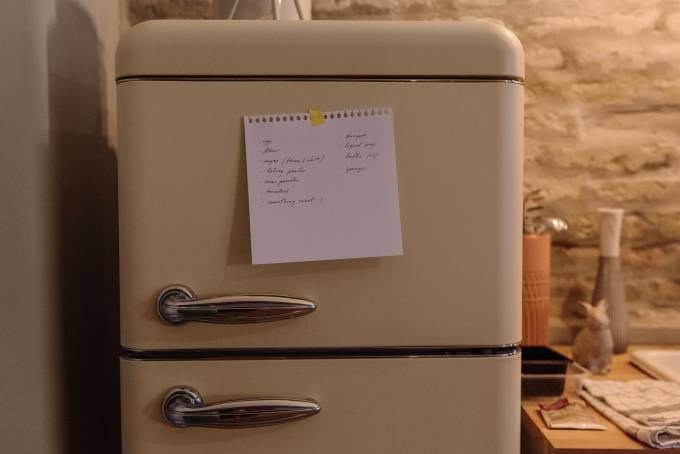 shopping notes sticked in a fridge.