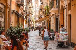 A street in Italy filled with people.