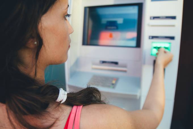 woman using an atm.