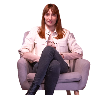 A young Italian freelancer sitting on an armchair.