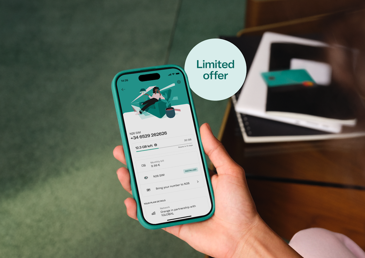 A person holds a smartphone displaying the N26 app with mobile plan details and an "Installed" N26 SIM status, featuring a "Limited offer" graphic badge overlay.