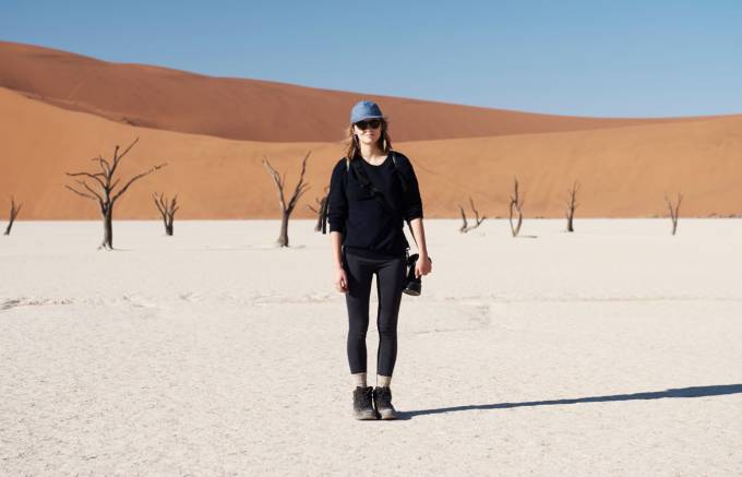 A person standing in a desert.