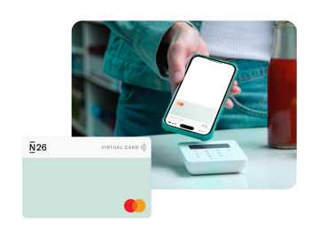 A person using the N26 virtual card to make a payment, with a close-up image of the virtual card in the foreground.