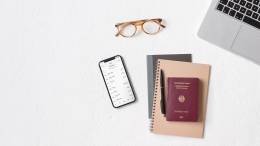 N26 app, glasses, passport and a laptop.