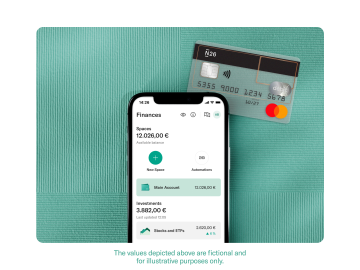 Mobile with the N26 app, next to a transparent card.