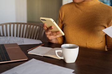 A person reviewing some papers and interest rates.