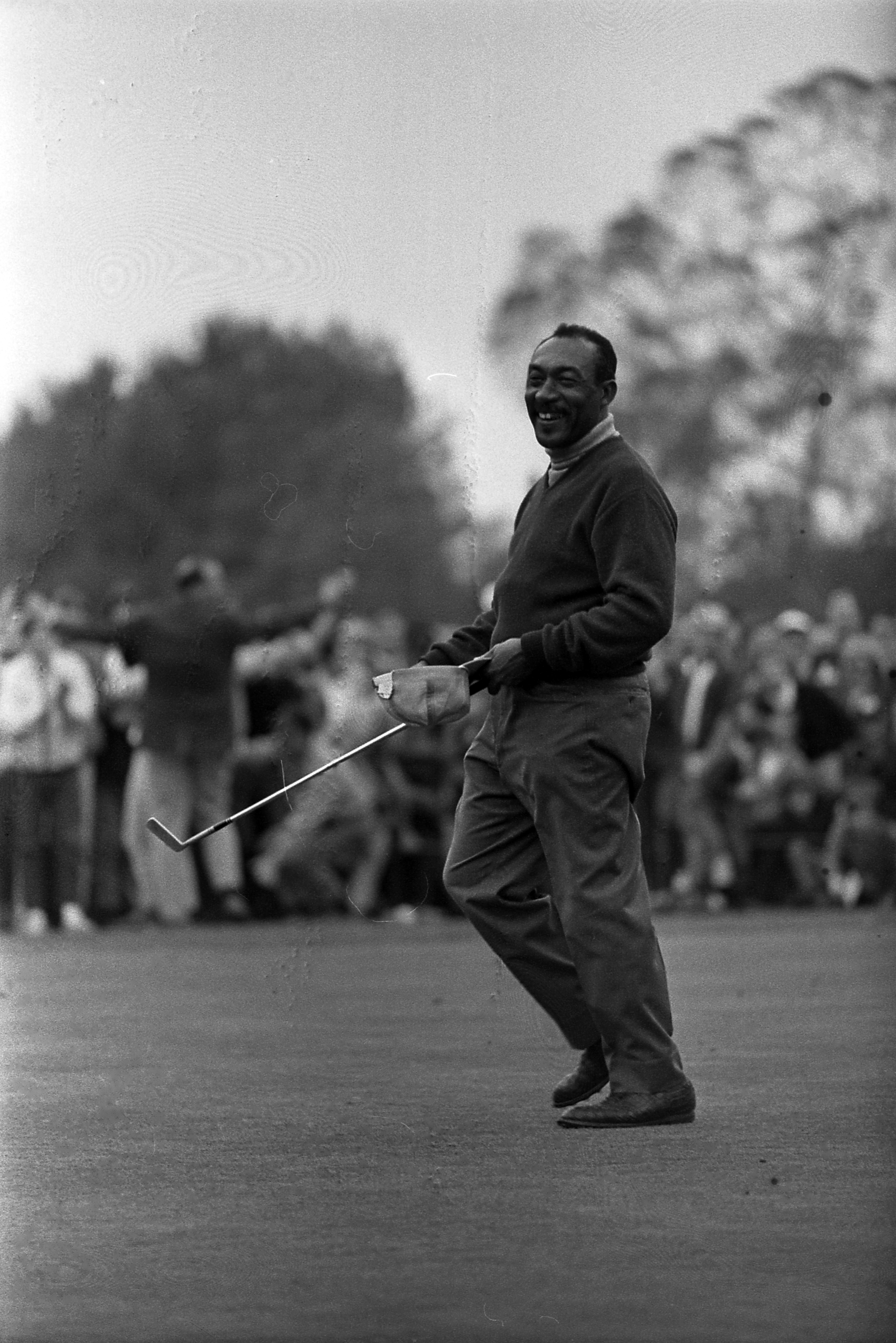 Charlie Sifford celebrates winning the 1969 Los Angeles Open at Rancho Park Golf Course. Photo by Ben Olender, Los Angeles Times Photographic Collection, UCLA Library. Licensed CC BY 4.0, via Wikimedia Commons (File:Charlie_Sifford_winning_1969_LA_Open.jpg).