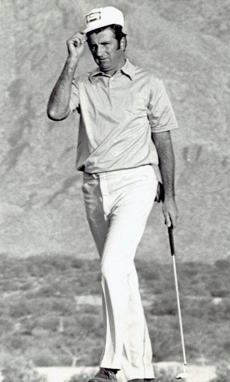 George Archer lining up a shot at the 1972 Tucson Open. Associated Press wire photo, 1972; public domain in the US (published 1931-1977 without a copyright notice). Source: https://commons.wikimedia.org/wiki/File:George_Archer_1972.jpg