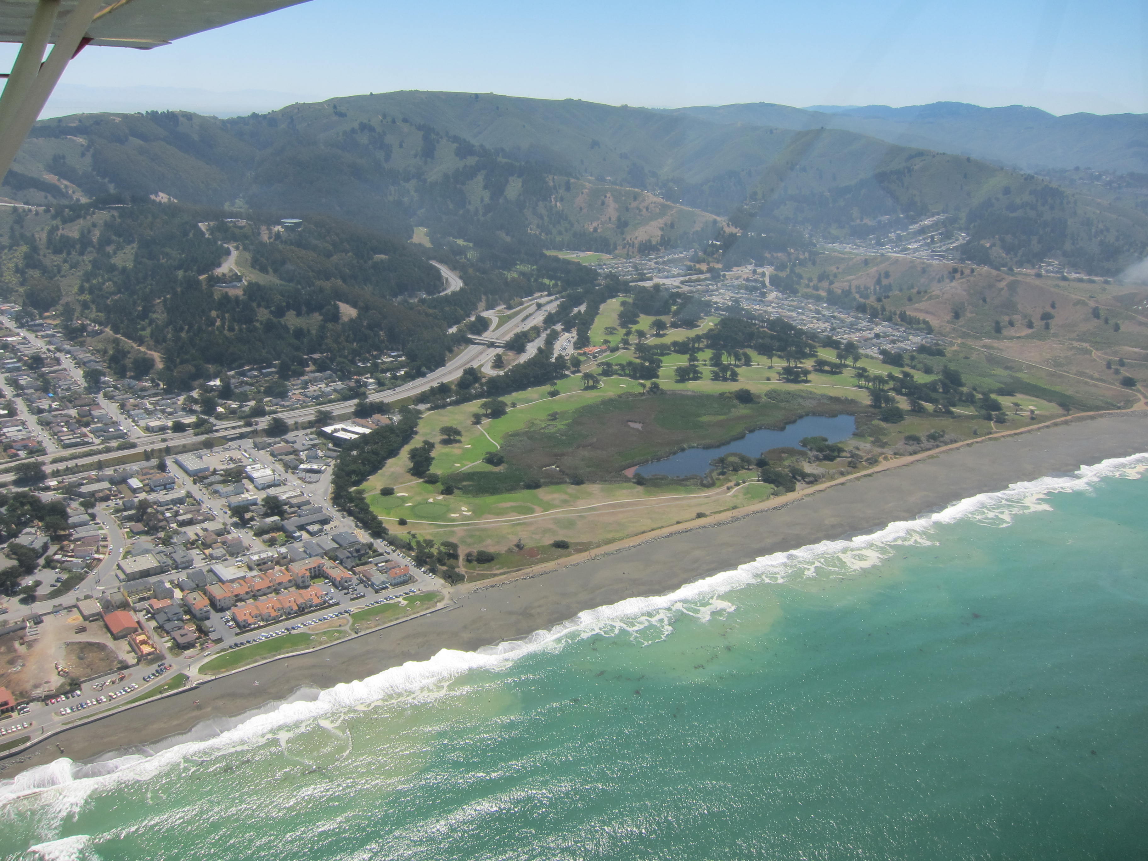 Laguna Salada and Sharp Park Golf Course in Pacifica, the Alister MacKenzie municipal course Jack Fleming helped build. Photo by Phliar, 2012, via Flickr/Wikimedia Commons, licensed CC BY-SA 2.0. Source: https://commons.wikimedia.org/wiki/File:Laguna_Salada_and_Sharp_Park_Golf_Course.jpg