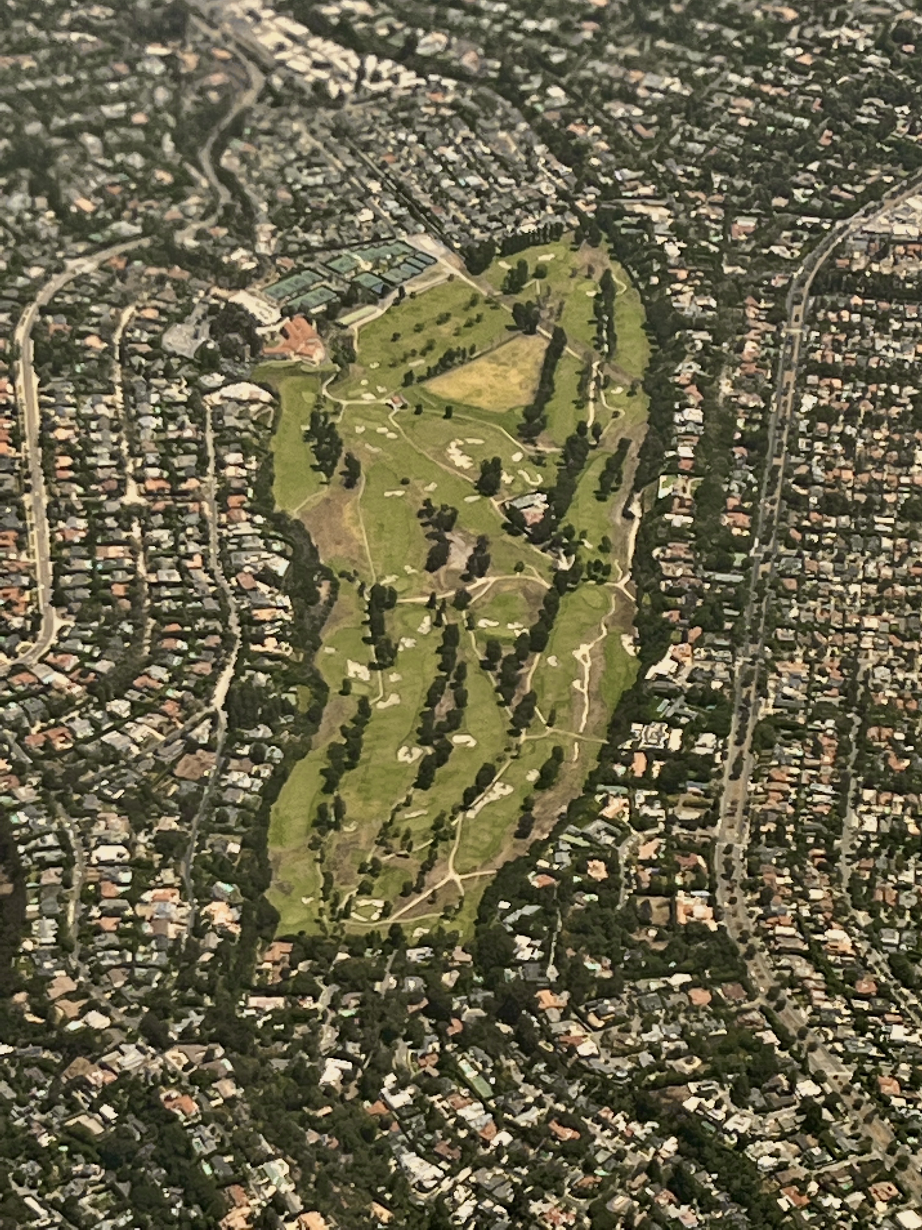Aerial view of Riviera Country Club in Pacific Palisades, Los Angeles, July 2022. Photo by Benoît Prieur, licensed CC0 1.0 Universal (public domain dedication). Source: https://commons.wikimedia.org/wiki/File:Aerial_view_of_Riviera_Country_Club_(Pacific_Palisades)_July_2022.jpg