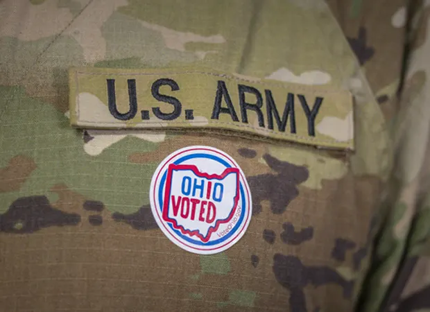 U.S. Army uniform with an I Voted Sticker on the left breast pocket.