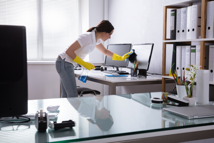 Woman cleaning an office