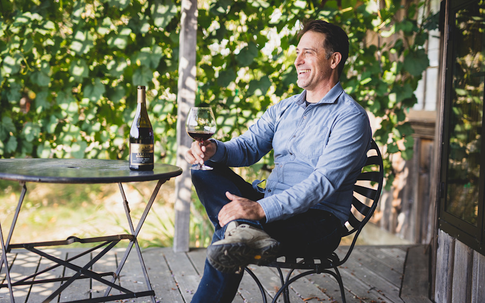 Derek Rohlffs Fall 2021 USA drinking a glass of red wine.