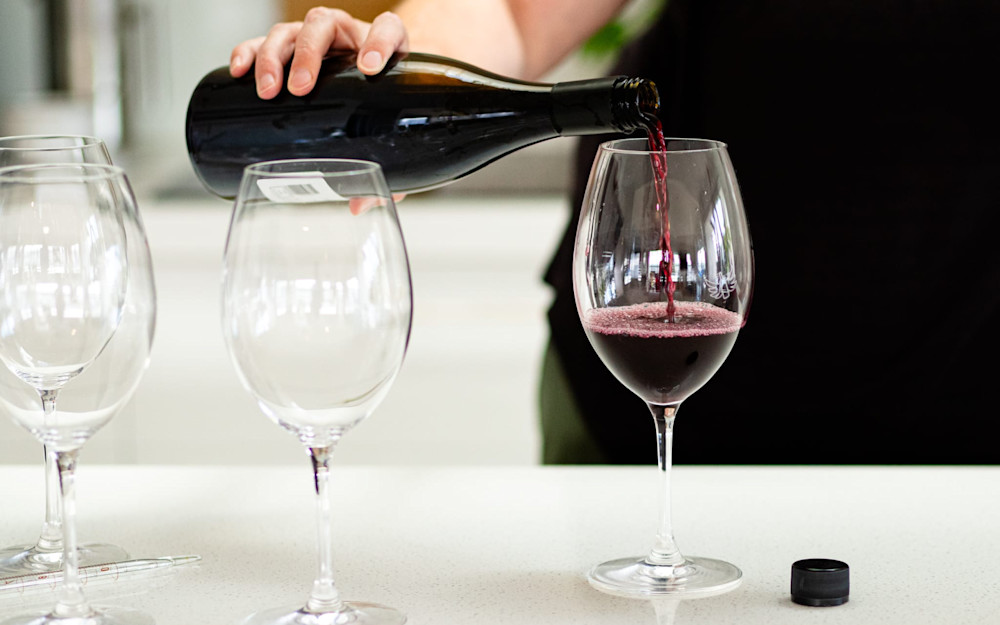 Dunnolly Nicky Parish pouring a glass of Pinot Noir