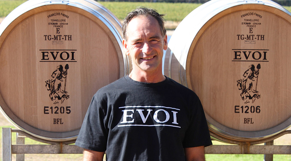 Nigel Ludlow with his Angel funded barrels of EVOI wine.
