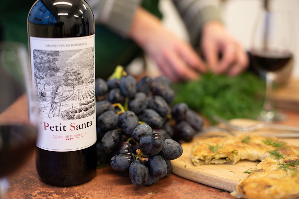 Bottle of Bordeaux with grapes