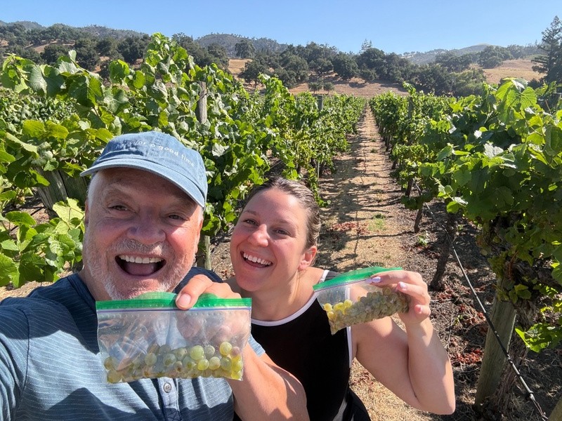 Daryl Groom and his daughter share a shot from harvest 2026, following a vineyard inspection during which they tested the sugar levels of grapes ripening ahead of picking.