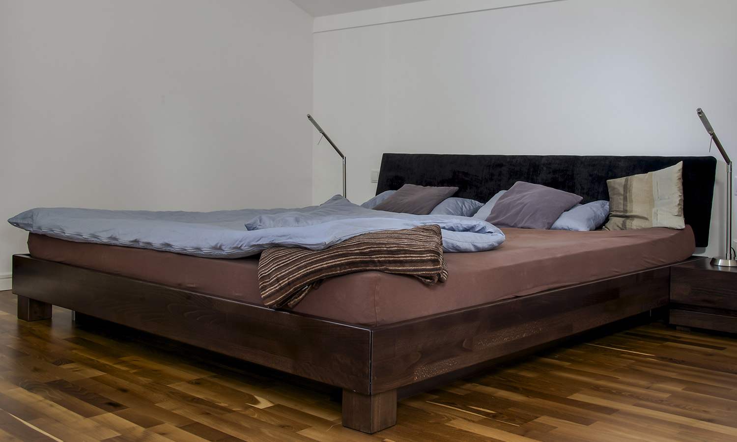 A waterbed mattress on a wodden frame