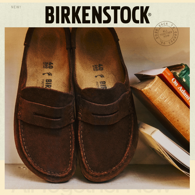 Pair of brown Birkenstock suede loafers with cork footbeds displayed in product box with NEW label at top