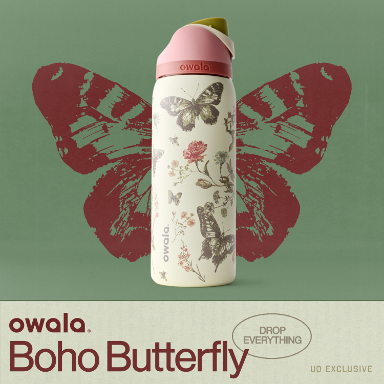 White water bottle with butterfly and floral design, pink lid, displayed against red butterfly wings on green background.