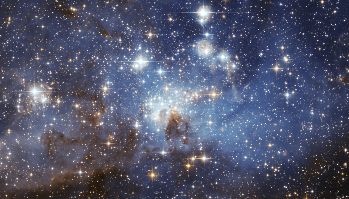 Colour photo of the LH 95 star forming region in the Large Magellanic Cloud.