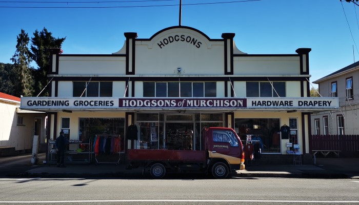 Photo of Hodgsons Store, Murchison. A truck is parked on the street in front.