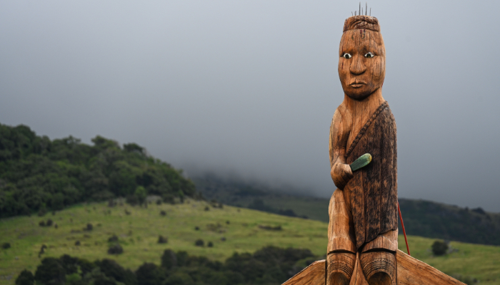 Image: The tekoteko on Ōnuku Marae and dark clouds looming (https://gg.govt.nz/image-galleries/10505/media?page=6) by Government House on The Governor-General of New Zealand.
