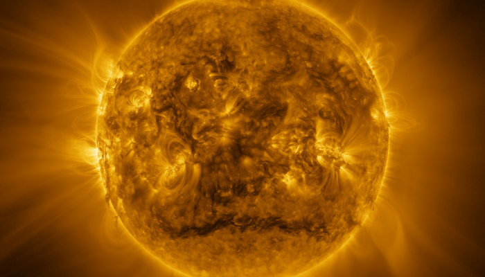 Colour photo of a detailed view of the Sun. It shows the Sun's hot atmosphere (corona) in ultraviolet light.
