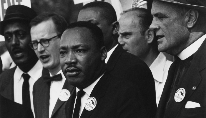 Image: Civil Rights March on Washington, D.C. [Dr. Martin Luther King, Jr. and Mathew Ahmann in a crowd.] (https://commons.wikimedia.org/wiki/File:Civil_Rights_March_on_Washington,_D.C._(Dr._Martin_Luther_King,_Jr._and_Mathew_Ahmann_in_a_crowd.)_-_NARA_-_542015_-_Restoration.jpg) by    
Rowland Scherman on Wikimedia Commons. CC0 1.0 (https://creativecommons.org/publicdomain/zero/1.0/deed.en). Image cropped.
