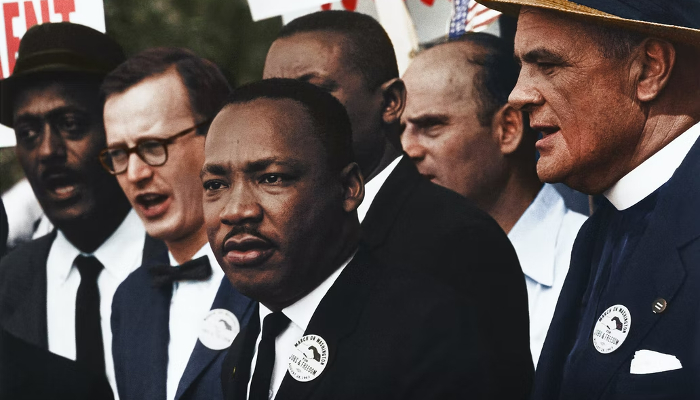 Colour photo of Martin Luther King Jr and supporters at the 'March on Washington for Jobs and Freedom' on 28 August 1963.