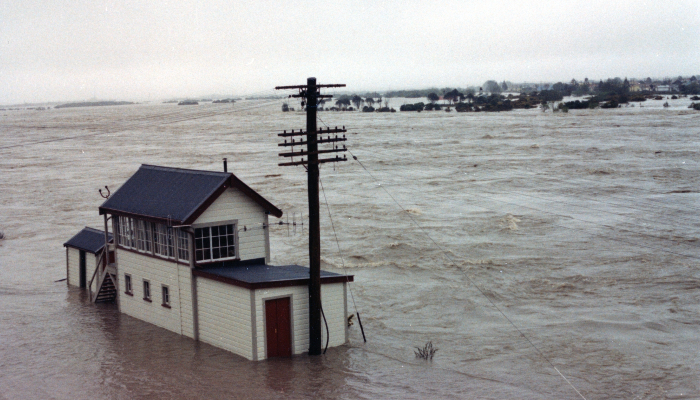 Colour photo from 1998  of the railway signal station on Mawhera Quay. It is surrounded by floodwater from the Grey River.