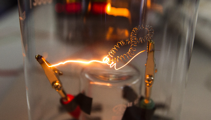 Colour photo of a filament in a DC (direct current) lightbulb.