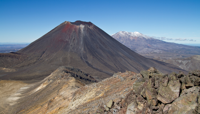 Colour photo of Mt Ngauruhoe and Mt Ruapehu seen from the summit of Mount Tongariro.