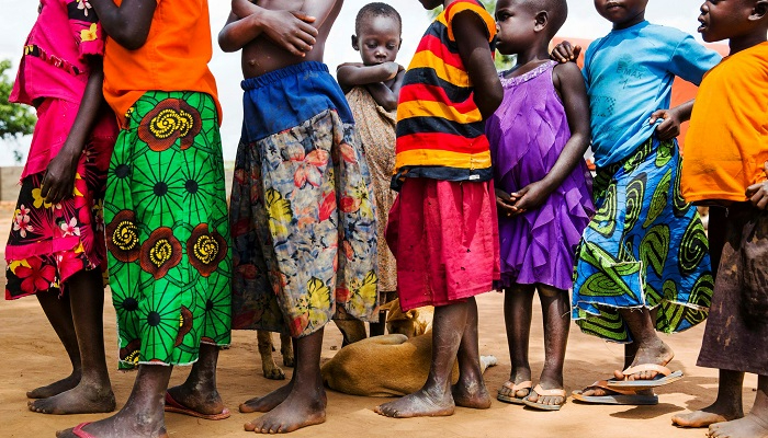 Young children wait to be processed at the Busia collection point near the Uganda/South Sudan border before their final destination of the Impvepi Refugee Camp on Friday, 23 June, 2017 in Busia, Uganda. 