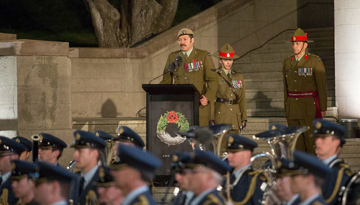 Colour photo of Corporal Willie Apiata reciting the Ode of Remembrance at a ceremony at the Pukeahu National War Memorial Park in Wellington.