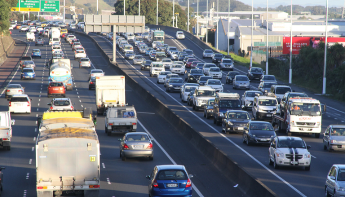Colour photo of cars and trucks on the Southern Motorway, Auckland.