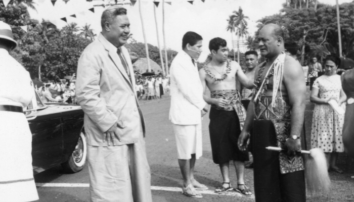 Black and white photo on Sāmoan Independence Day, 1 January 1962. Shows joint Head of State Tupua Tamasese Mea'ole (left) greeting Prime Minister Fiame Mata'afa Faumuina.